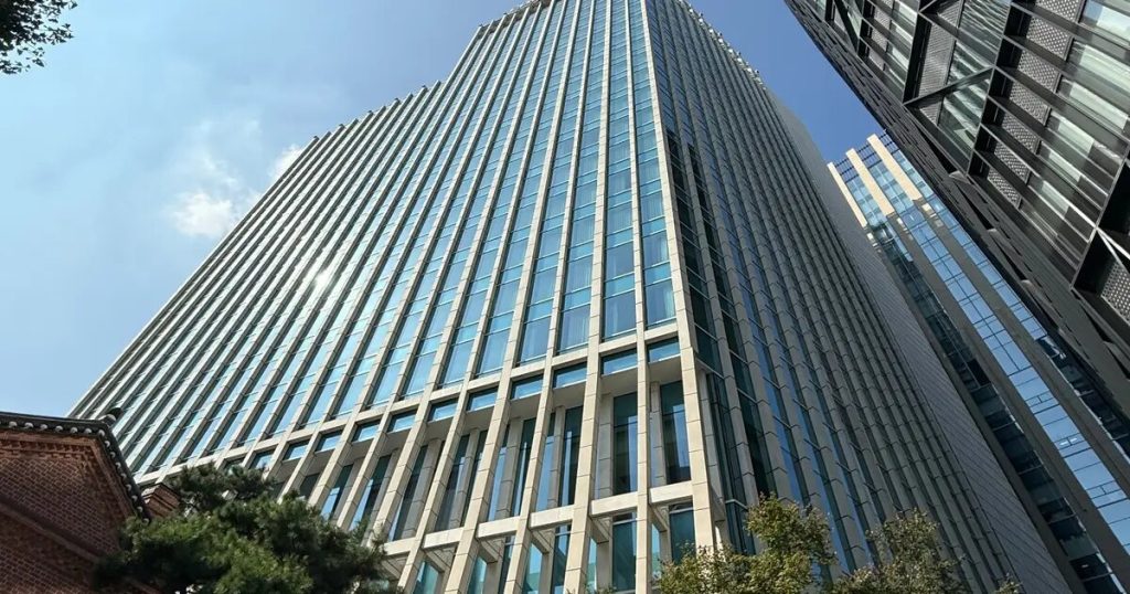 Modern office buildings beside traditional Korean architecture in central Seoul